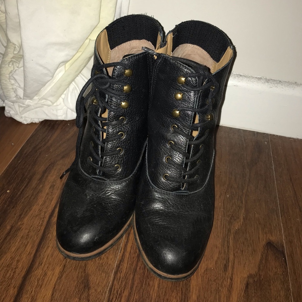 Black leather heeled booties with laces